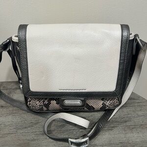 Brighton leather snakeskin embossed purse in tans with snap front closure.